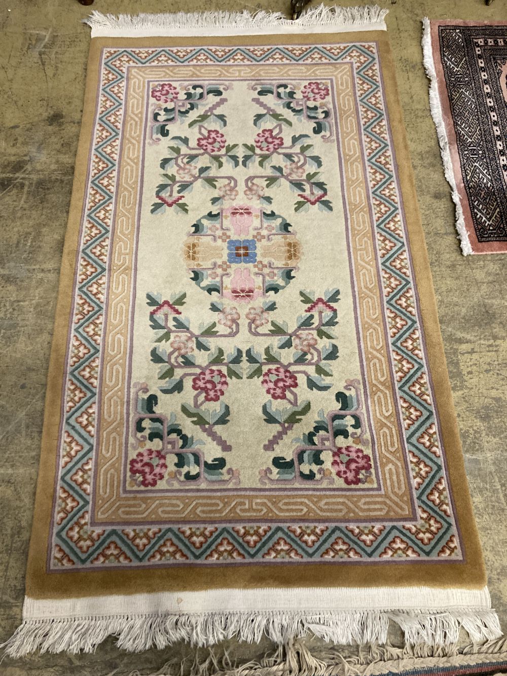 A Bokhara red ground small carpet, a pink ground runner and two other rugs (4), largest 320 x 222cm